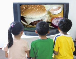 Boys and Girl Watching Television --- Image by Â© Studio DL/Corbis